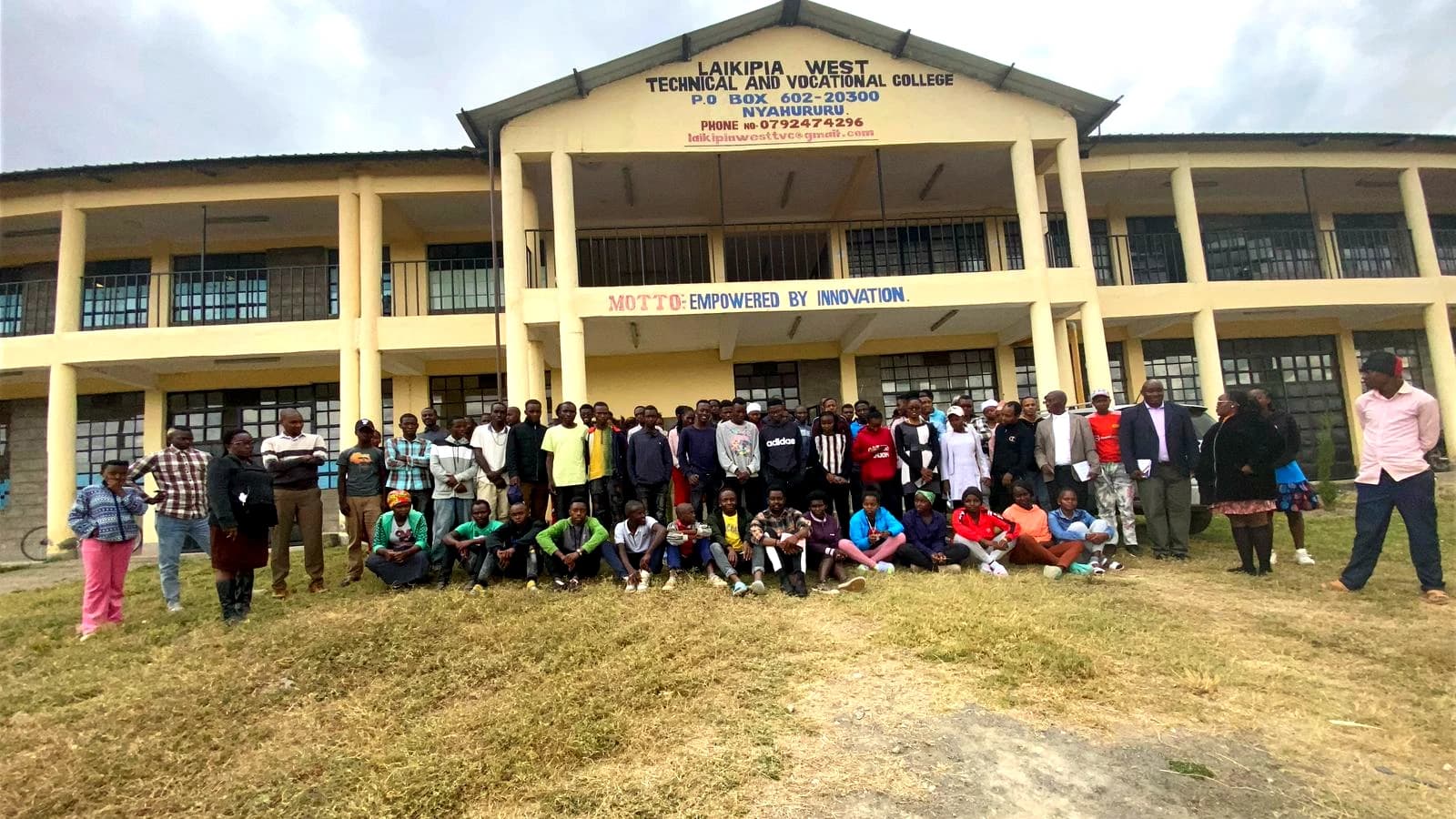 Laikipia West Technical and Vocational College building with students and staff gathered outside